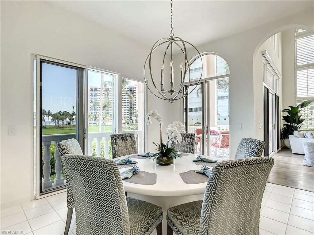 21 Casa Mar Lane, Unit 21 Naples, FL 34103 - Photo 19 of 47 a view of a dining room with furniture window and outside view