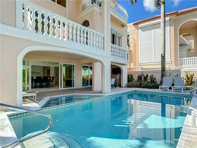 a front view of a house with garden and porch