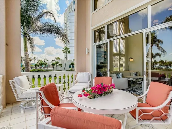 a outdoor dining space with furniture and outdoor view