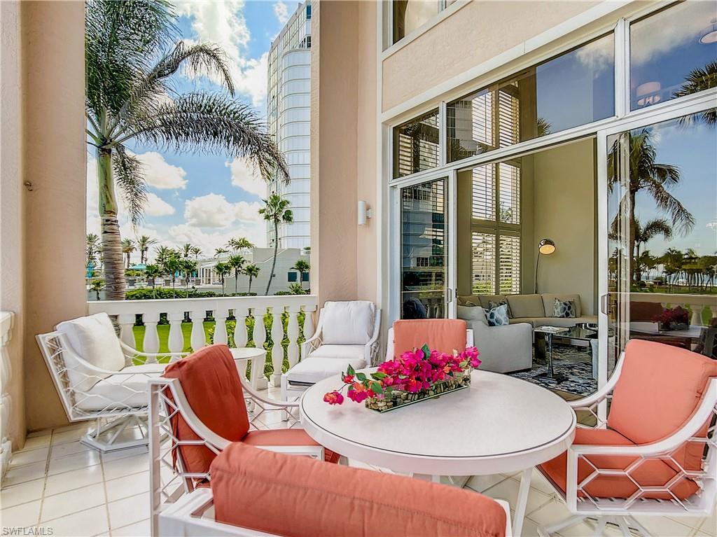 21 Casa Mar Lane, Unit 21 Naples, FL 34103 - Photo 5 of 47 a outdoor dining space with furniture and outdoor view