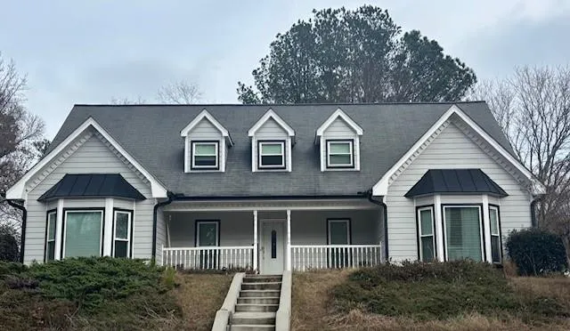 front view of a house with a yard