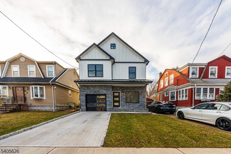 228 Locust Street Roselle, NJ 07203 - Photo 1 of 35 a front view of a house with yard and parking