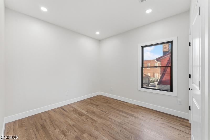 228 Locust Street Roselle, NJ 07203 - Photo 14 of 35 an empty room with a window