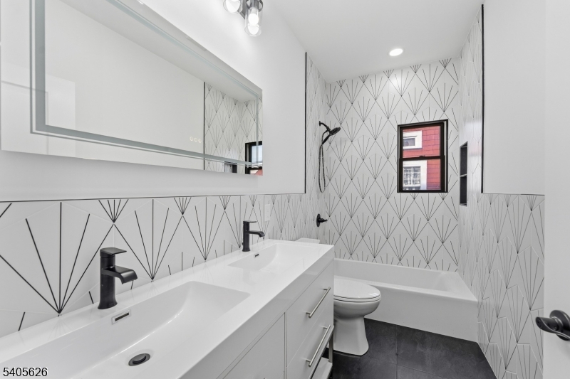 228 Locust Street Roselle, NJ 07203 - Photo 15 of 35 a bathroom with a sink a toilet and a bathtub