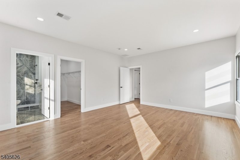 228 Locust Street Roselle, NJ 07203 - Photo 17 of 35 wooden floor in an empty room with a window
