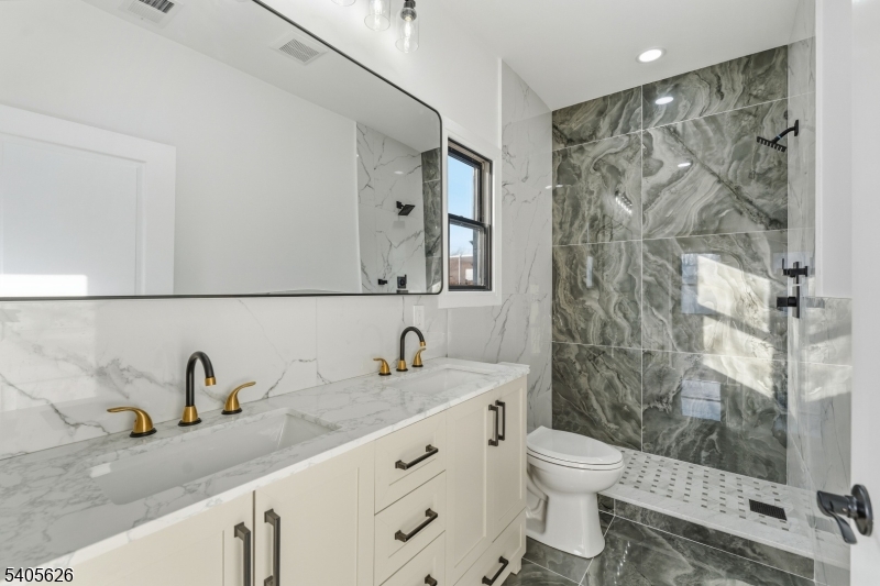 228 Locust Street Roselle, NJ 07203 - Photo 18 of 35 a bathroom with a sink and a mirror