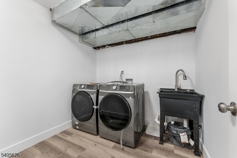 228 Locust Street Roselle, NJ 07203 - Photo 24 of 35 a utility room with dryer and washer