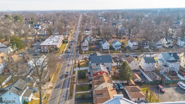 an aerial view of residential building and parking space