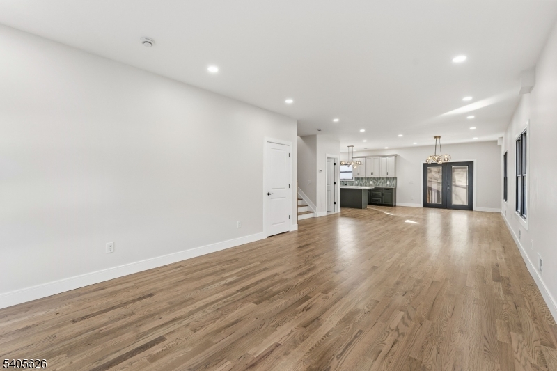 228 Locust Street Roselle, NJ 07203 - Photo 6 of 35 a view of kitchen and hall with wooden floor