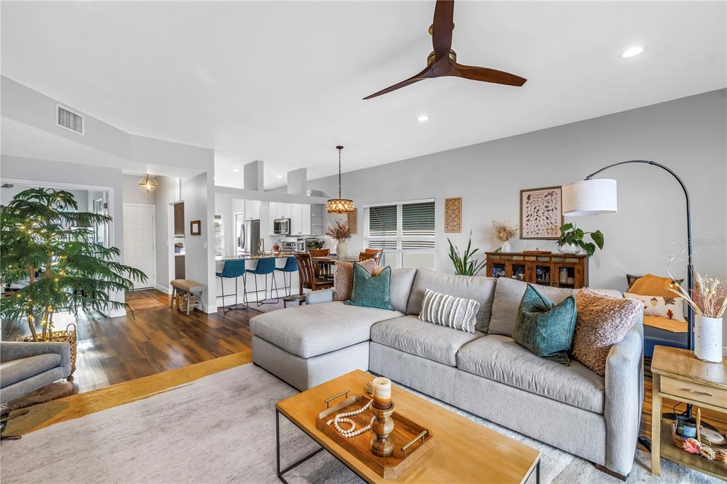 6311 99th Way North, Unit 11A St. Petersburg, FL 33708 - Photo 14 of 52 a living room with furniture and a view of kitchen