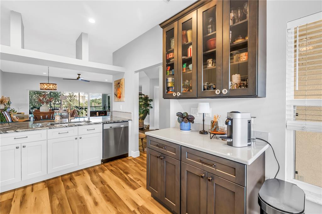 6311 99th Way North, Unit 11A St. Petersburg, FL 33708 - Photo 21 of 52 a kitchen with a sink cabinets and appliances