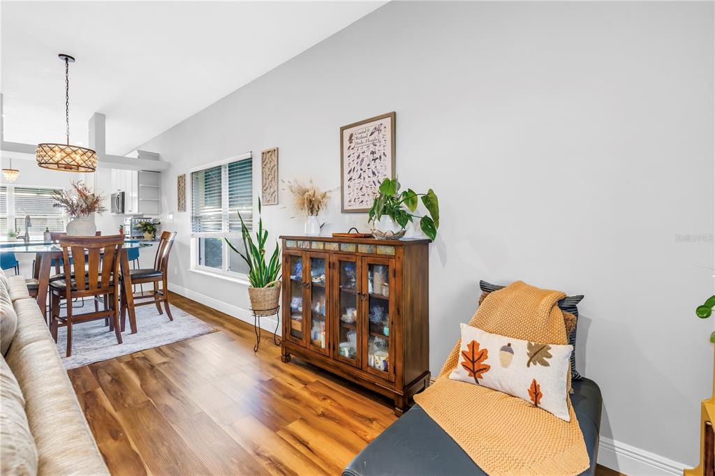 6311 99th Way North, Unit 11A St. Petersburg, FL 33708 - Photo 22 of 52 a living room with furniture and wooden floor