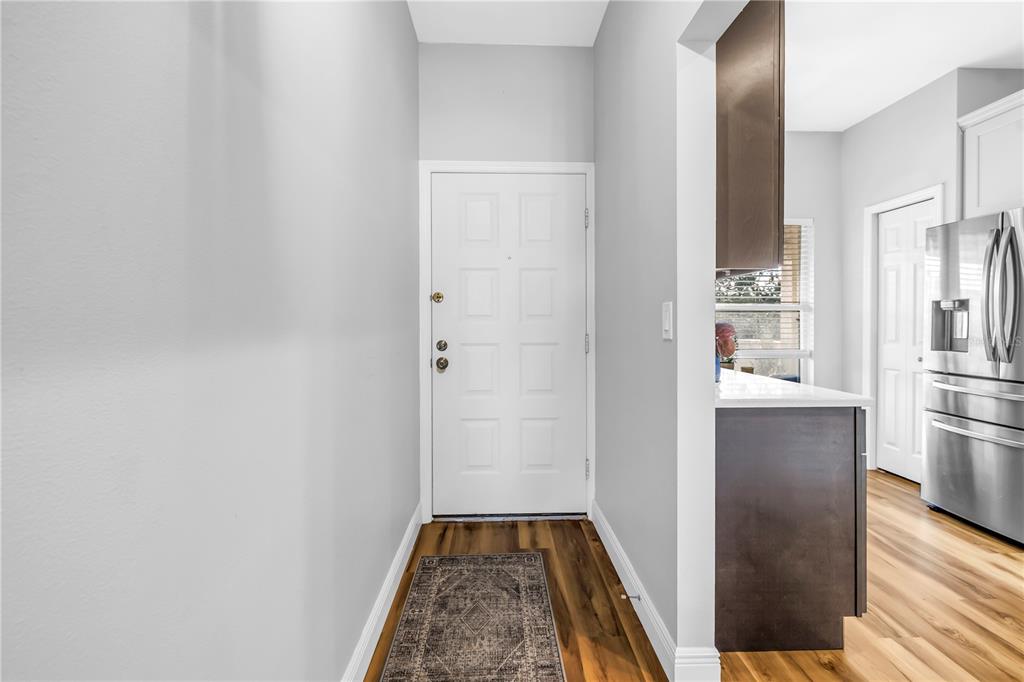 6311 99th Way North, Unit 11A St. Petersburg, FL 33708 - Photo 23 of 52 a view of a kitchen from the hallway