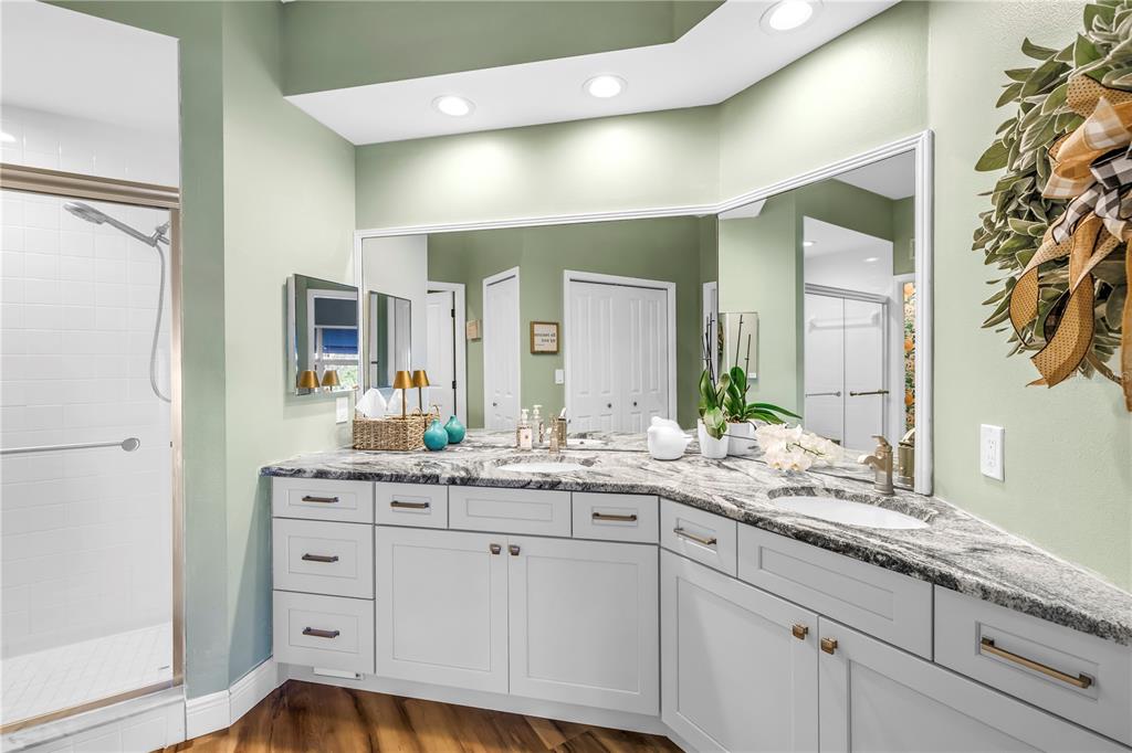 6311 99th Way North, Unit 11A St. Petersburg, FL 33708 - Photo 27 of 52 a bathroom with a sink and a mirror