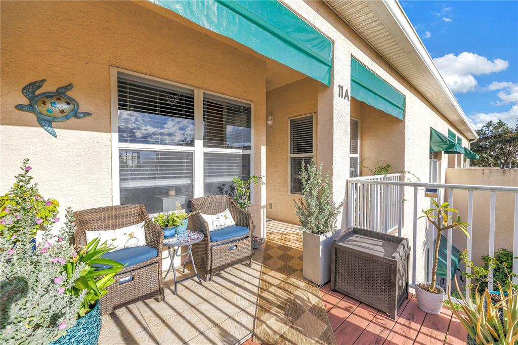 6311 99th Way North, Unit 11A St. Petersburg, FL 33708 - Photo 6 of 52 a view of a deck with furniture