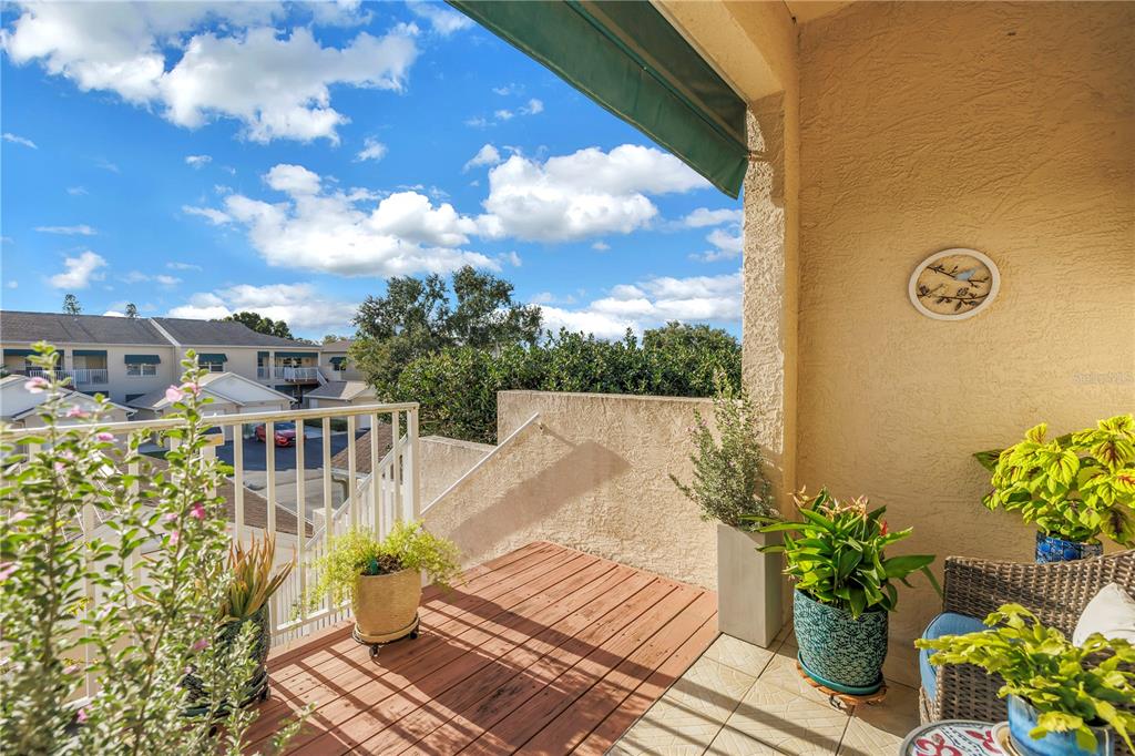 6311 99th Way North, Unit 11A St. Petersburg, FL 33708 - Photo 7 of 52 a view of a balcony with wooden floor