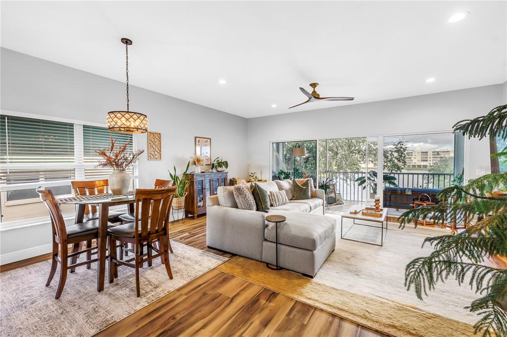 6311 99th Way North, Unit 11A St. Petersburg, FL 33708 - Photo 10 of 52 a living room with furniture and wooden floor