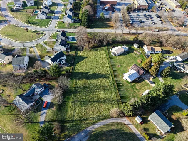 an aerial view of a house with outdoor space