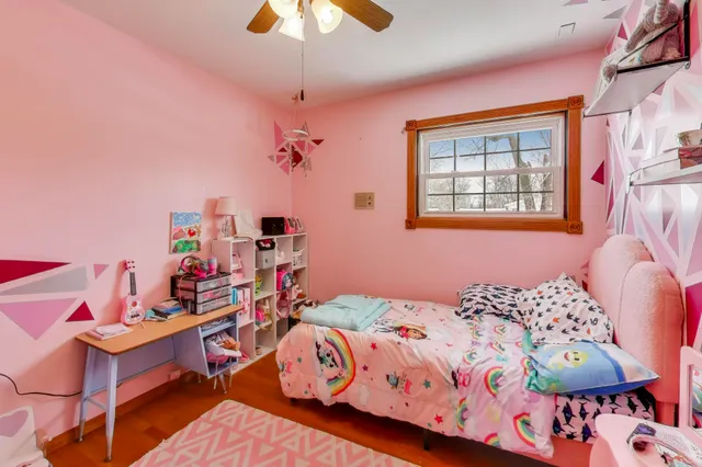 a bedroom with furniture and a chandelier