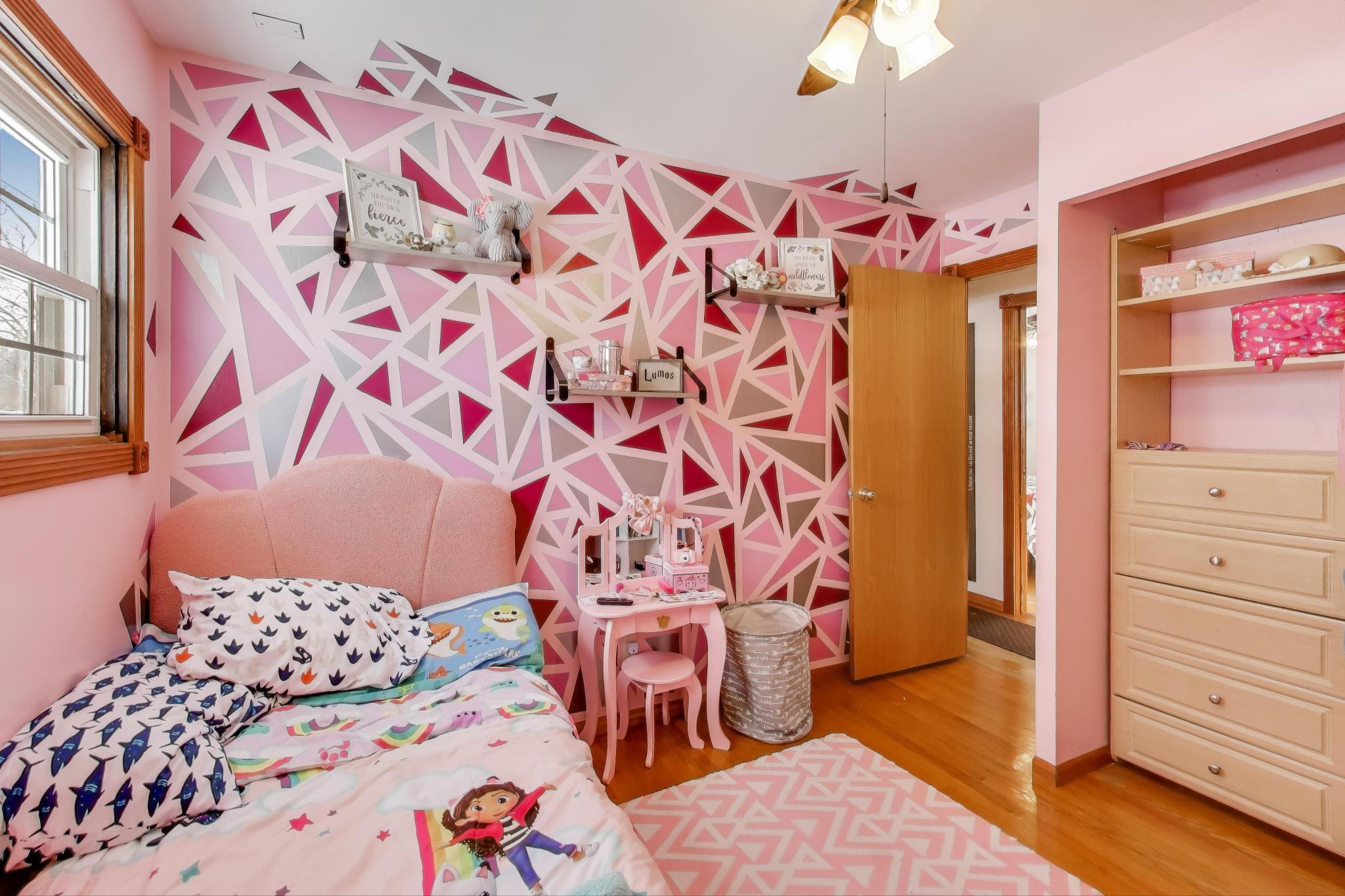 1044 North Rensselaer Street Griffith, IN 46319 - Photo 16 of 32 a bedroom with a bed and a dresser
