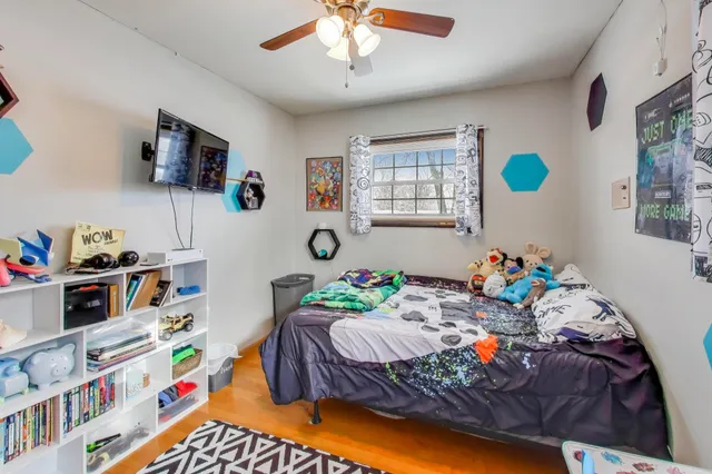 a bedroom with bed and a window