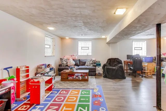 a living room with lots of furniture and a rug