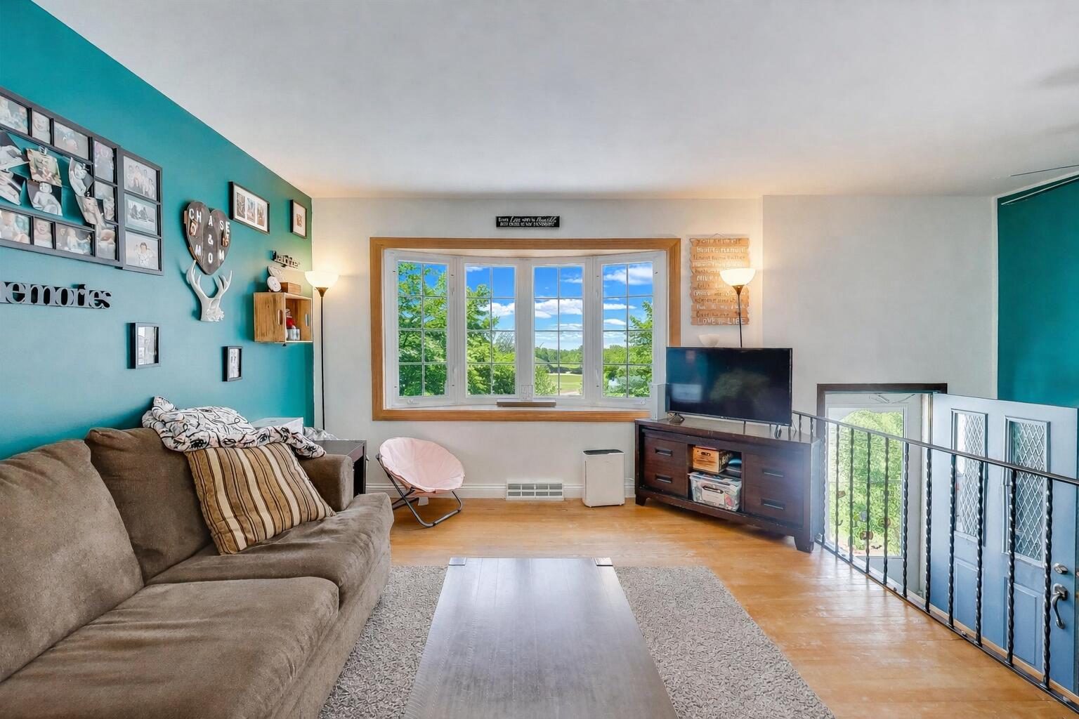 1044 North Rensselaer Street Griffith, IN 46319 - Photo 4 of 32 a living room with furniture and a flat screen tv