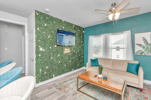 a living room with furniture and a large window