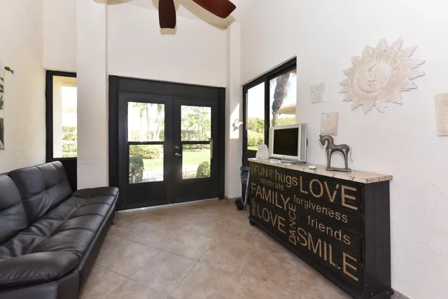 a bedroom with furniture and a window