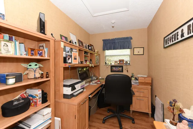 a bedroom with furniture and a book shelf