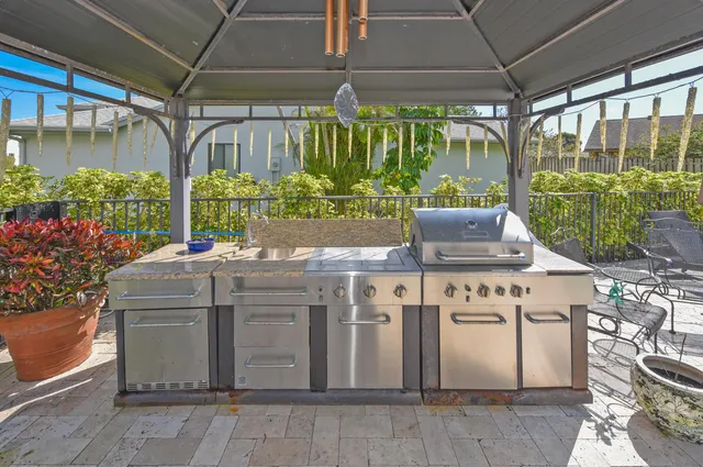 a kitchen with a stove and a shower