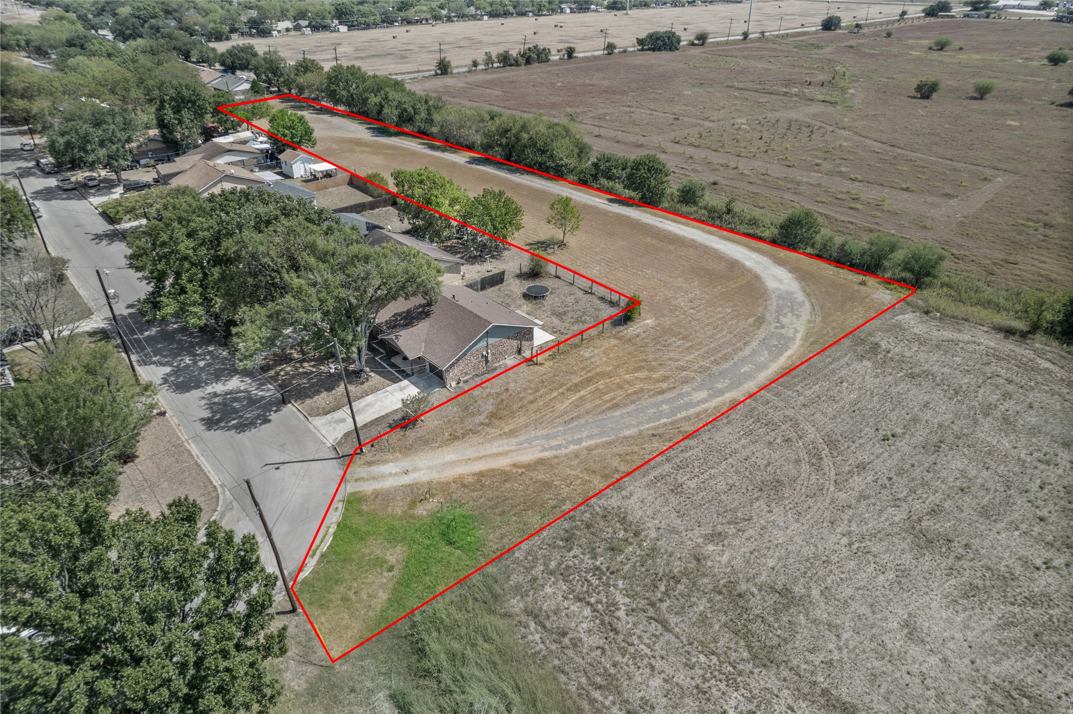 1508 Pendergrass Street Lockhart, TX 78644 - Photo 12 of 13 a view of a pathway with a yard