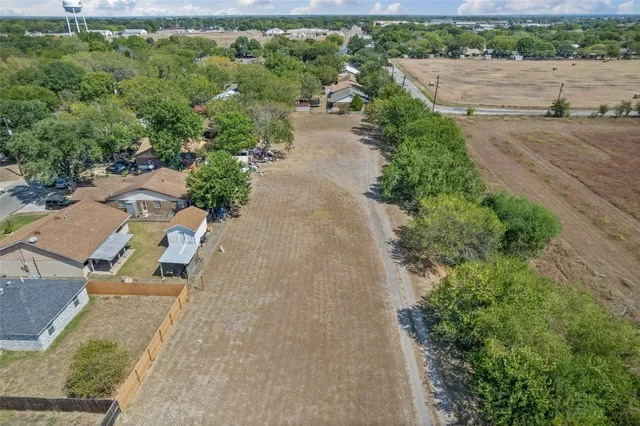 an aerial view of a house with outdoor space