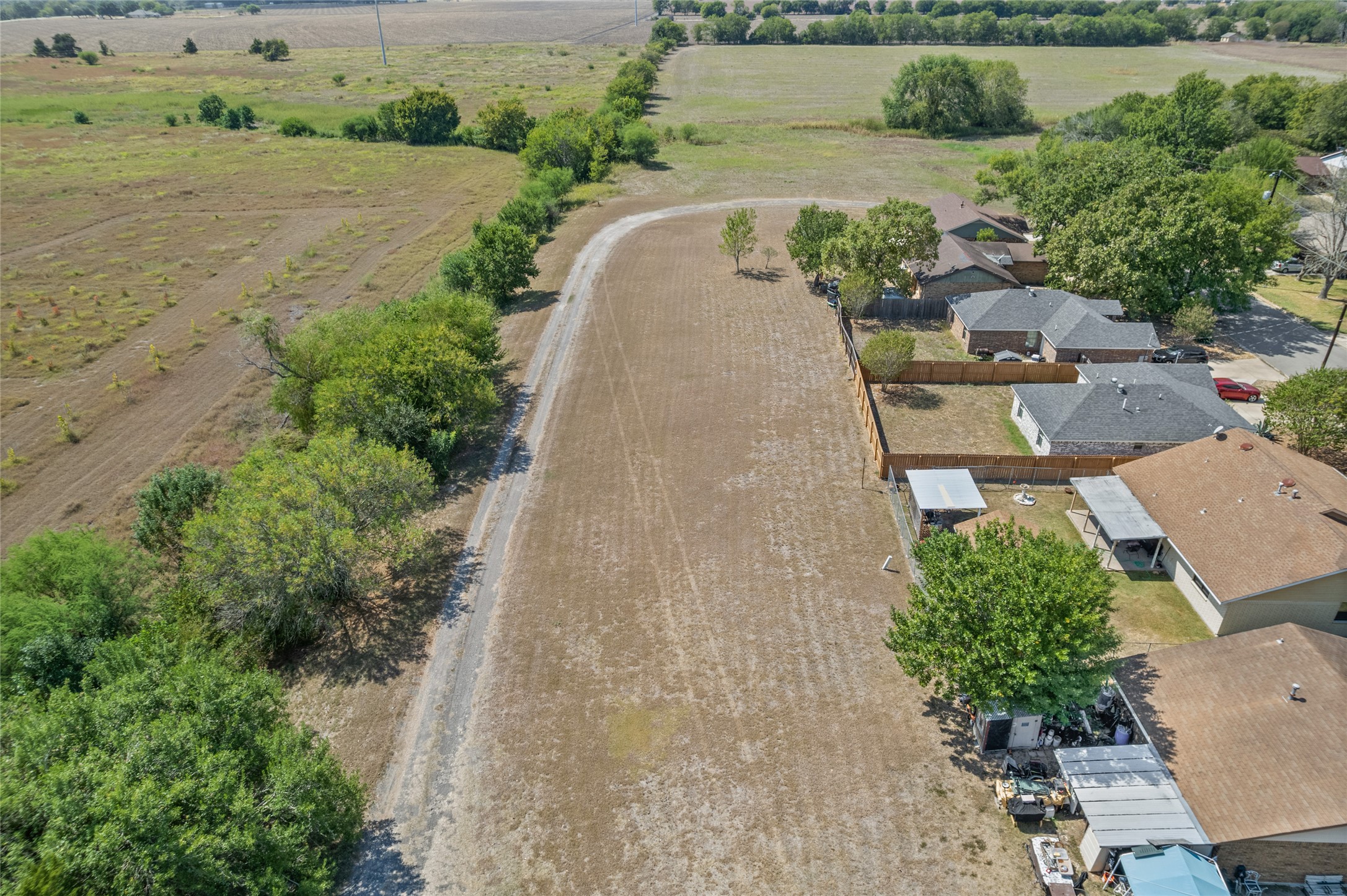 1508 Pendergrass Street Lockhart, TX 78644 - Photo 10 of 13 an aerial view of a house with a yard and lake view