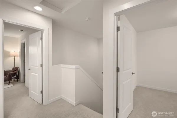 a view of a house with a yard and wooden fence