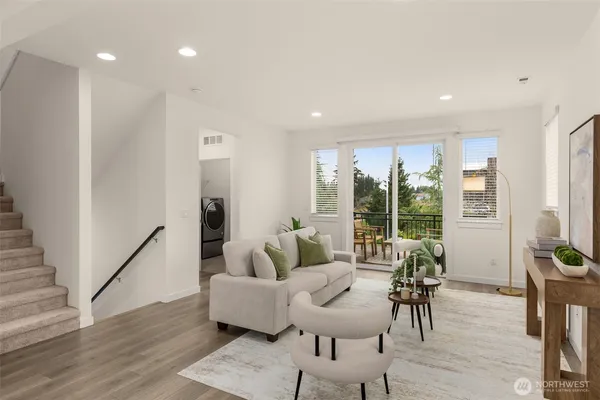 a living room with furniture and windows