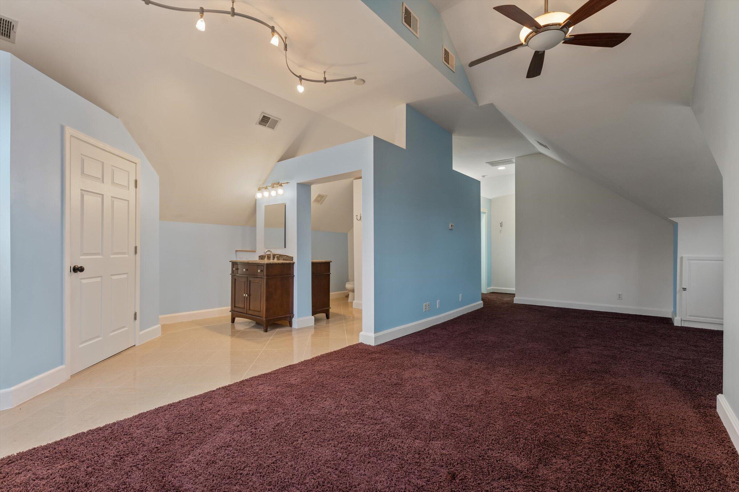 7692 North Emery Road Rolling Prairie, IN 46371 - Photo 47 of 69 a view of a livingroom with a ceiling fan and entryway
