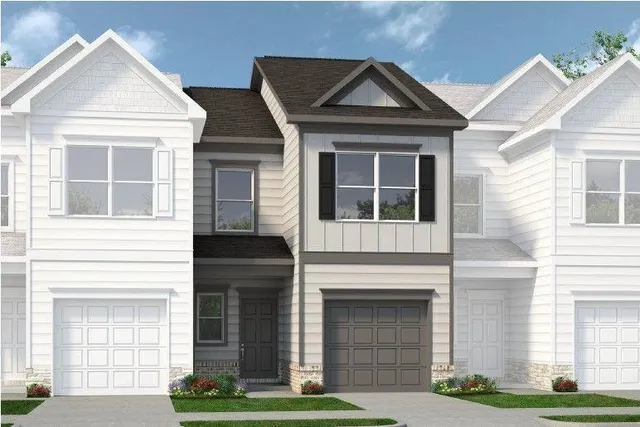 a front view of a house with garage