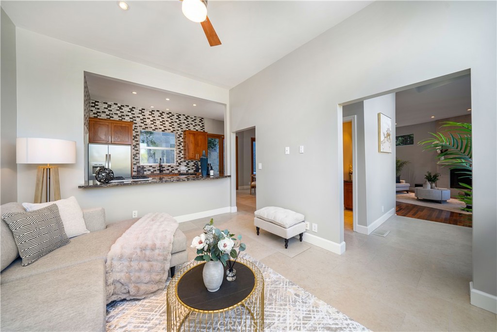 4104 Vanetta Place Studio City, CA 91604 - Photo 11 of 45 a living room with furniture and a large mirror