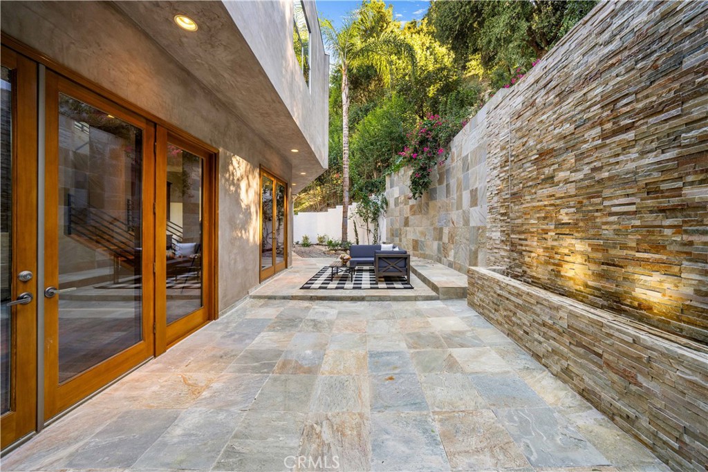 4104 Vanetta Place Studio City, CA 91604 - Photo 20 of 45 a view of a bathroom with a sink and glass door