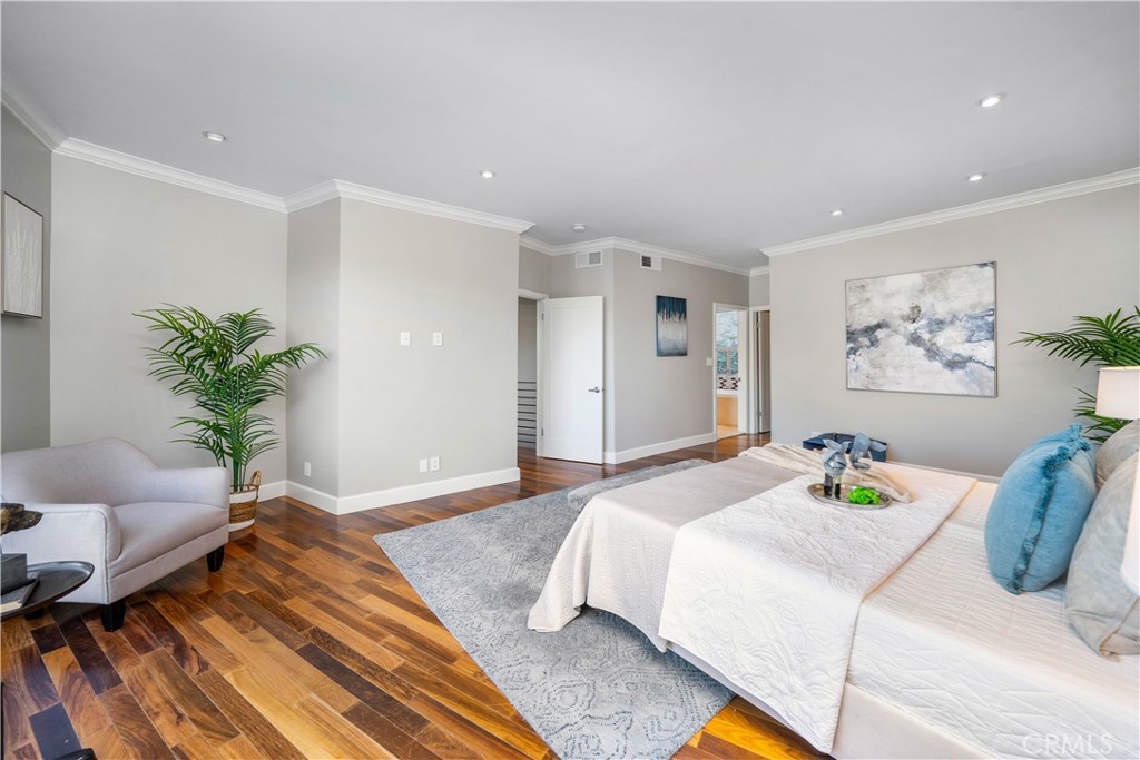 4104 Vanetta Place Studio City, CA 91604 - Photo 25 of 45 a bedroom with a large bed and a potted plant