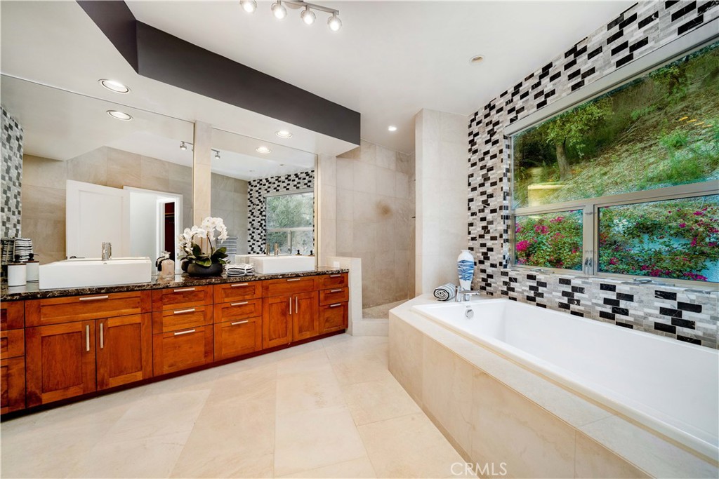4104 Vanetta Place Studio City, CA 91604 - Photo 27 of 45 a large white bathroom with a large tub and sink