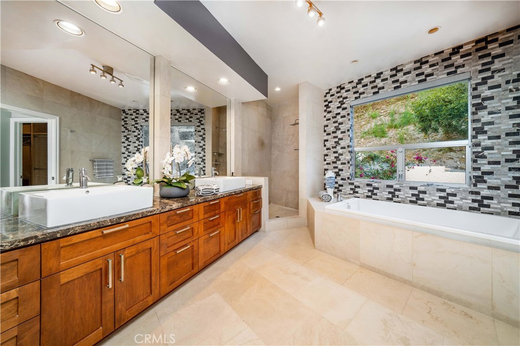 4104 Vanetta Place Studio City, CA 91604 - Photo 28 of 45 a large bathroom with a large tub and sink