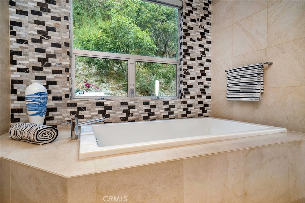 4104 Vanetta Place Studio City, CA 91604 - Photo 29 of 45 a bath tub sitting next to a window