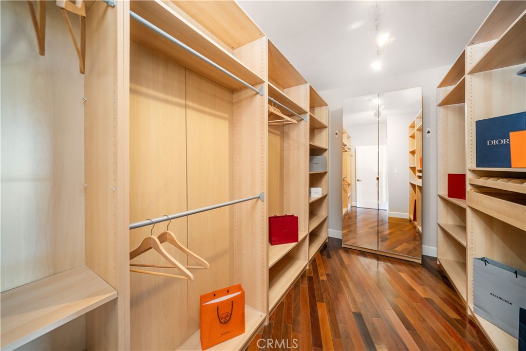 4104 Vanetta Place Studio City, CA 91604 - Photo 30 of 45 a view of walk in closet with clothes and shoes