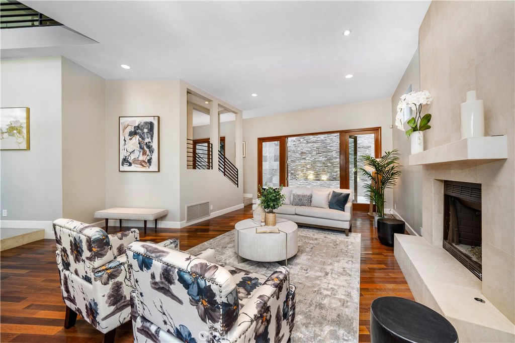 4104 Vanetta Place Studio City, CA 91604 - Photo 3 of 45 a living room with furniture large window and a fireplace