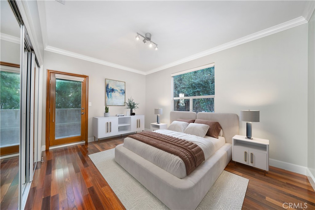 4104 Vanetta Place Studio City, CA 91604 - Photo 33 of 45 a bedroom with a large bed and a window