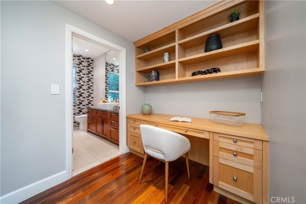 4104 Vanetta Place Studio City, CA 91604 - Photo 34 of 45 a room with a wooden floor and furniture