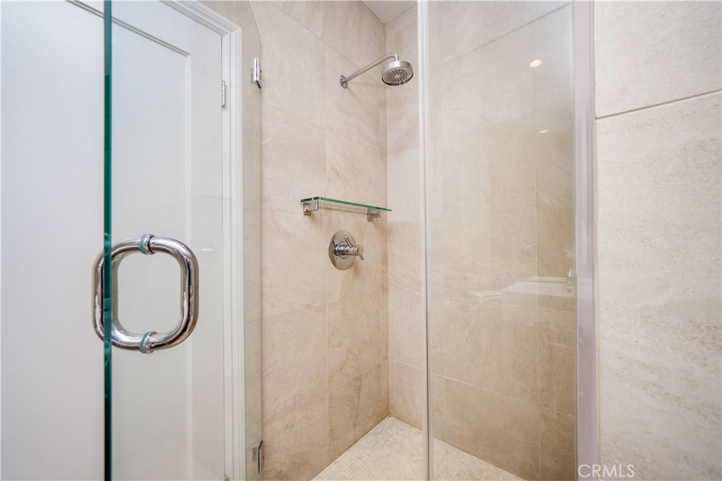 4104 Vanetta Place Studio City, CA 91604 - Photo 37 of 45 a bathroom with a granite countertop shower mirror and a sink