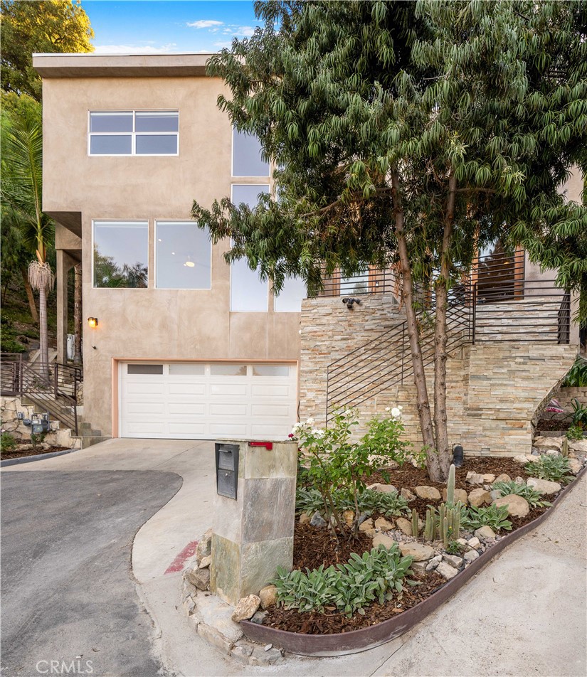 4104 Vanetta Place Studio City, CA 91604 - Photo 39 of 45 a view of a house with a small yard and large tree
